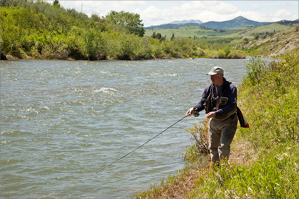 Mark fishing a riffle