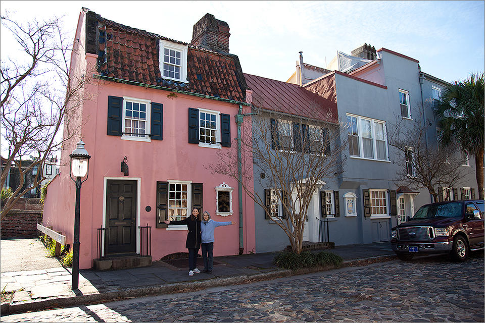 The Pink House, with cobblestone street